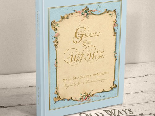 traditional hardcover personalized wedding guest book featuring and antique french cottage style frame in blue personalized with names and wedding date