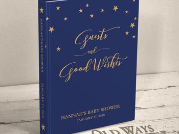 dark navy blue traditional baby shower guest book with gold stars across the top the cover is personalized with name and shower date and reads "guests and good wishes"